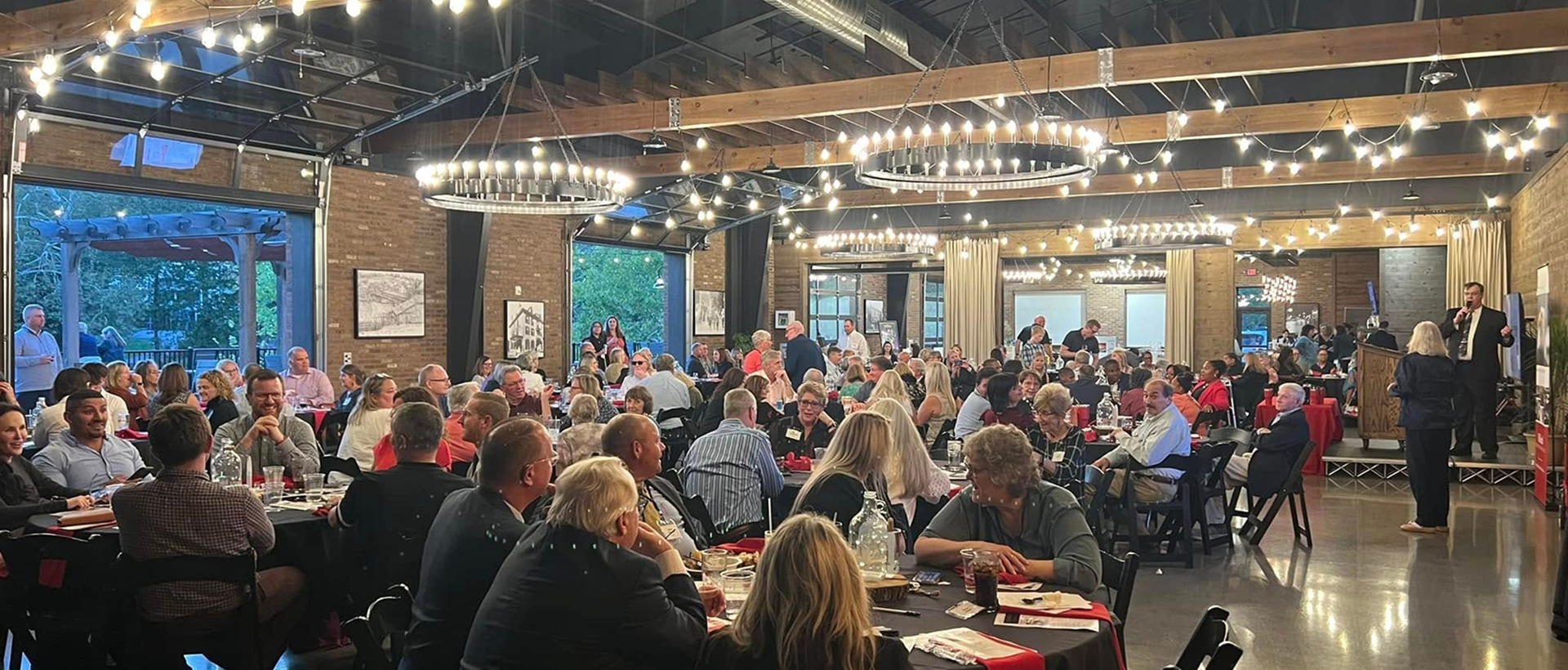 crowd of people sitting at tables